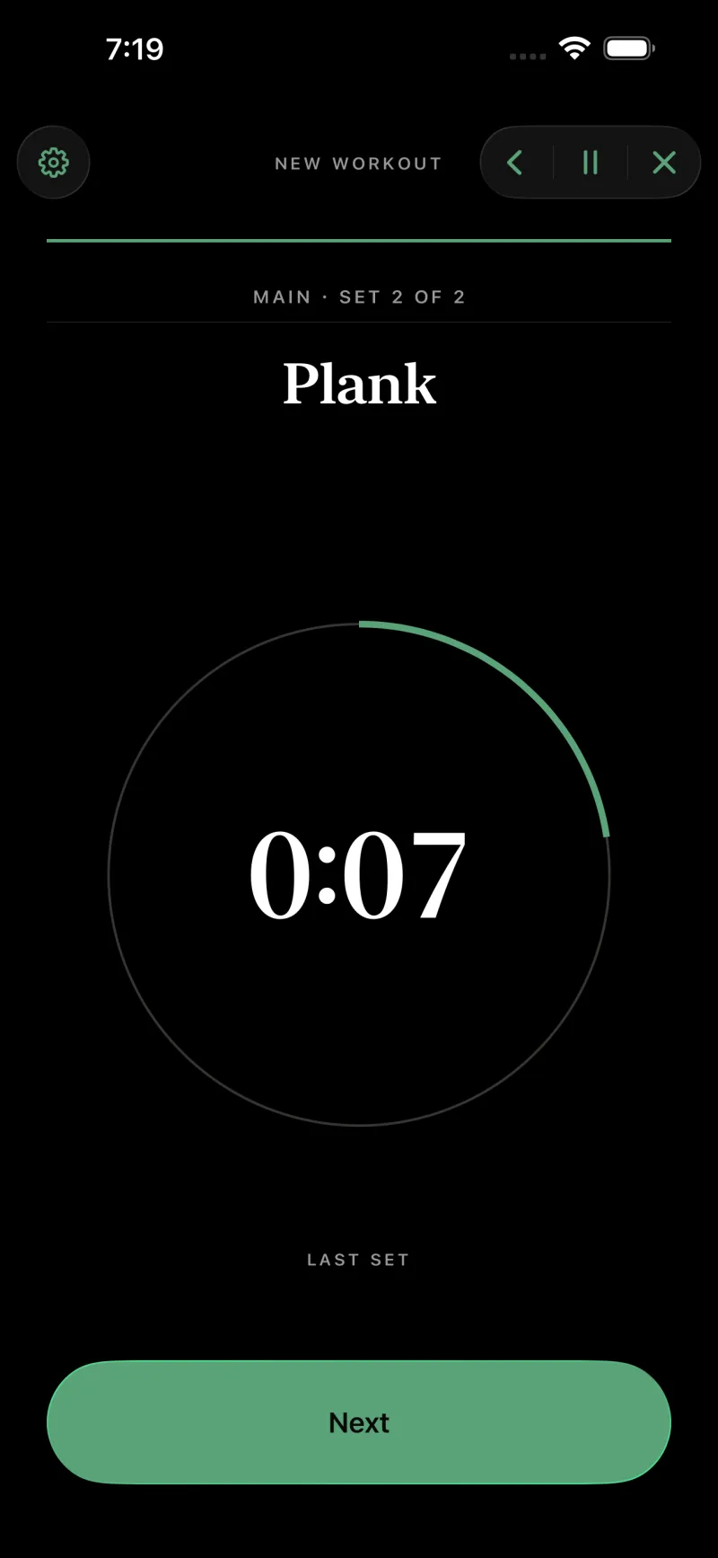 The player running a timed set: the exercise Plank, MAIN · SET 2 OF 2, and a thick green ring most of the way round a countdown reading 0:23.